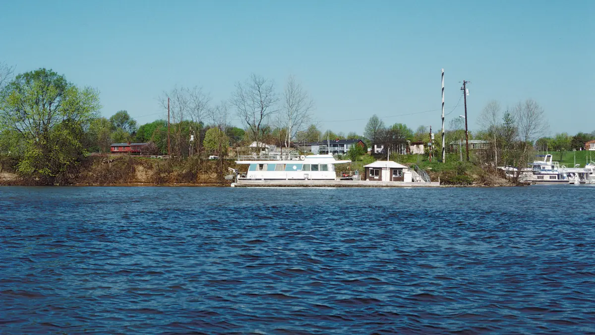 Boats and houseboats at a marina on the Ohio River near Louisville